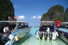 2 Phuket Private Boat Charter rental on water at Phi Phi Island.