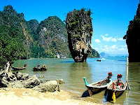 Rock on Phang Nga Bay speedboat tours with green water and mangrove